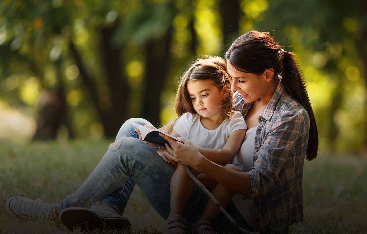 mom and daughter reading a book